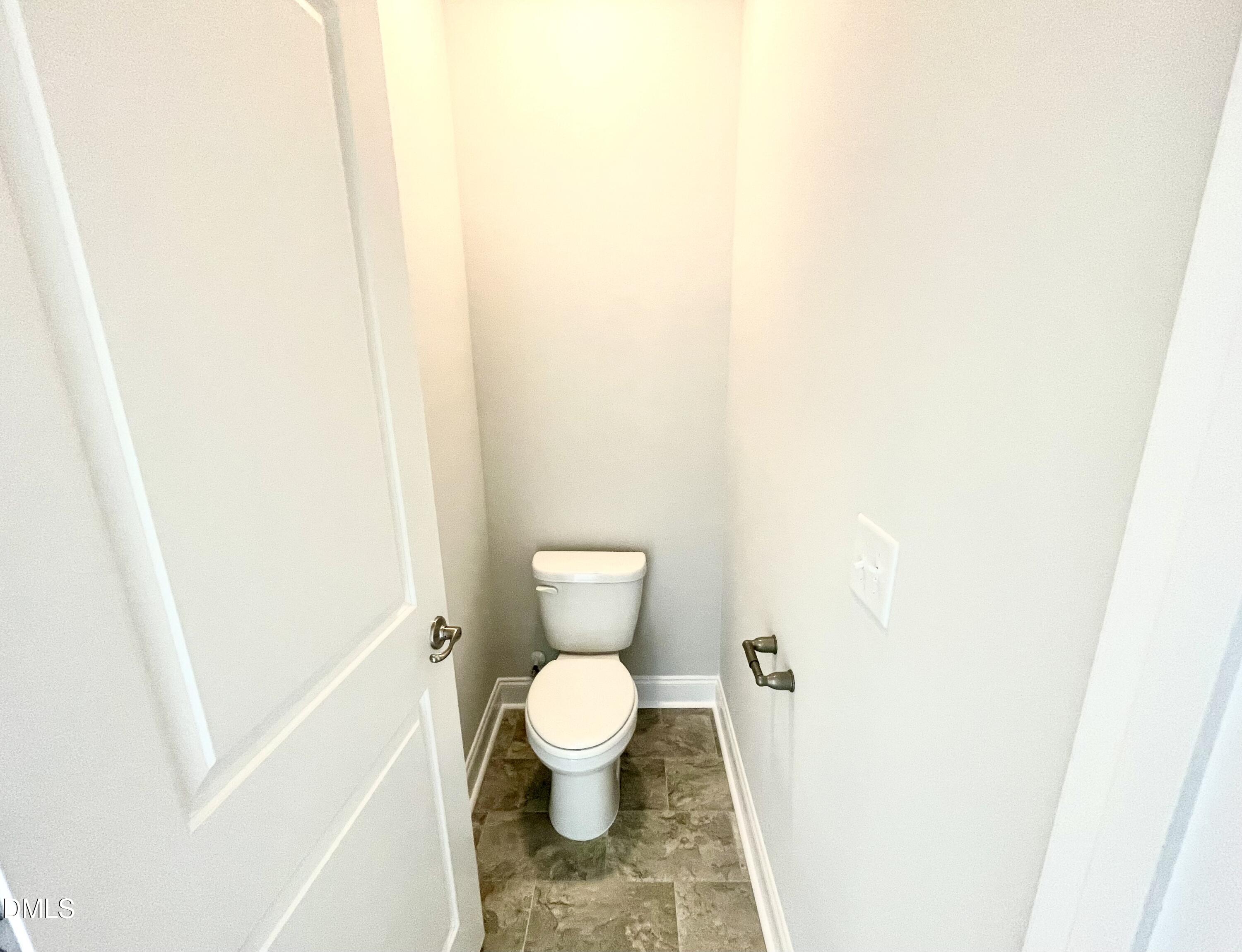 39 Deep Blue Trail Middlesex, NC 27557 - Photo 16 of 37 a white toilet sitting next to a shower