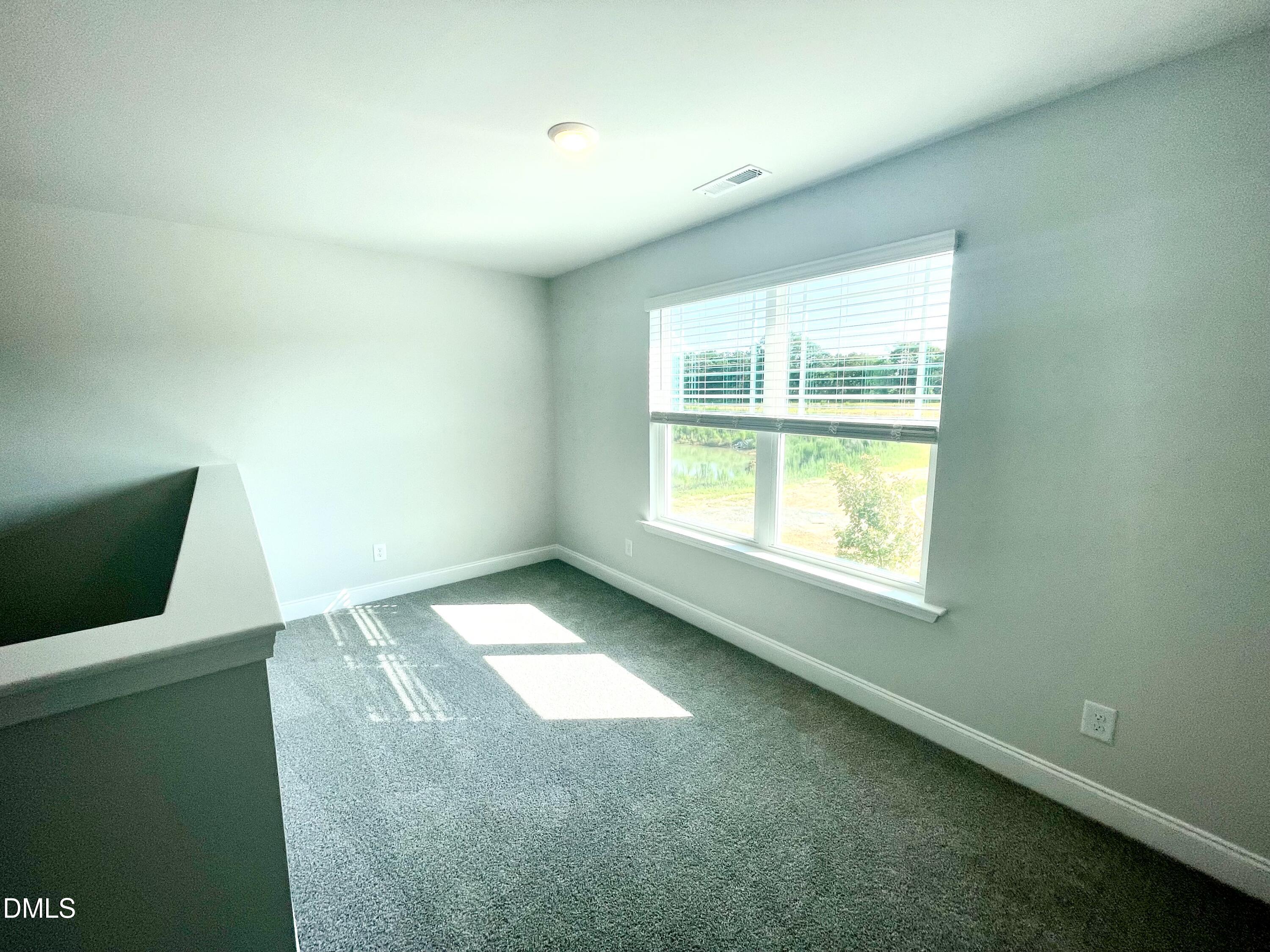 39 Deep Blue Trail Middlesex, NC 27557 - Photo 19 of 37 a view of an empty room with a window