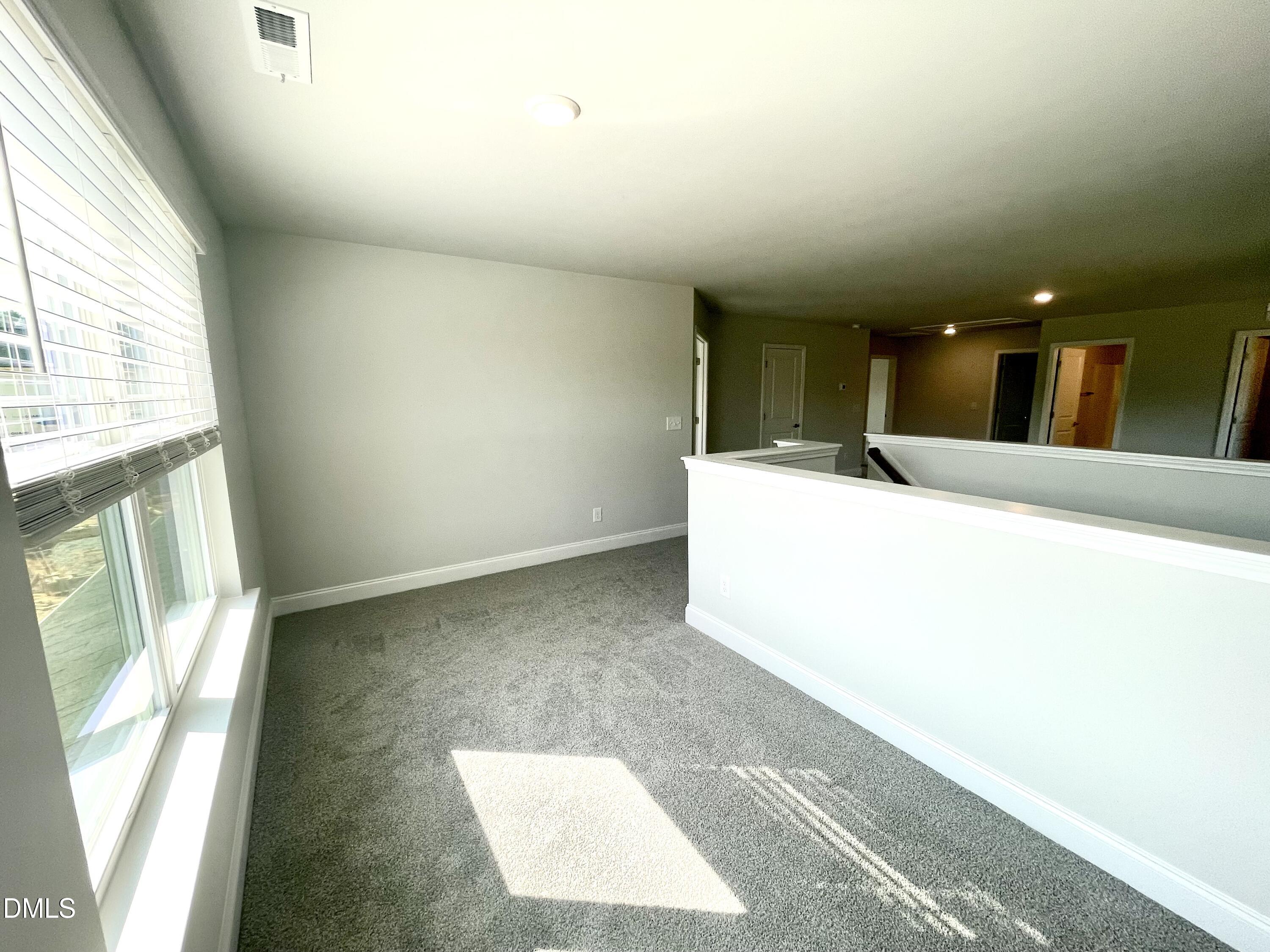 39 Deep Blue Trail Middlesex, NC 27557 - Photo 20 of 37 a view of a kitchen with a sink and a large window