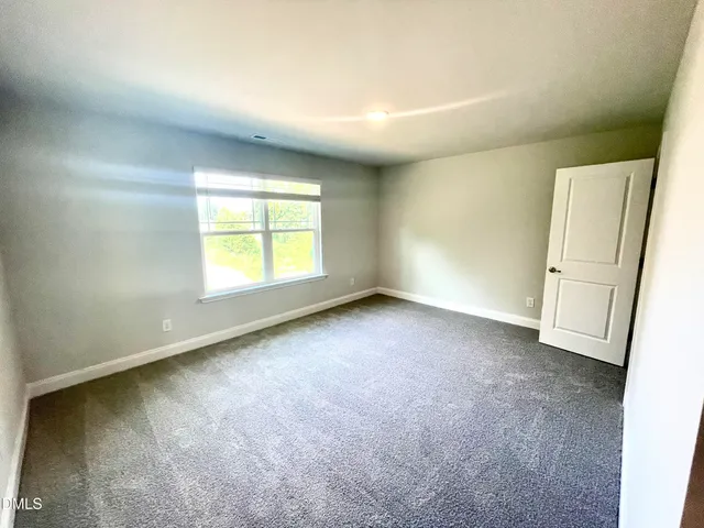 an empty room with a natural light