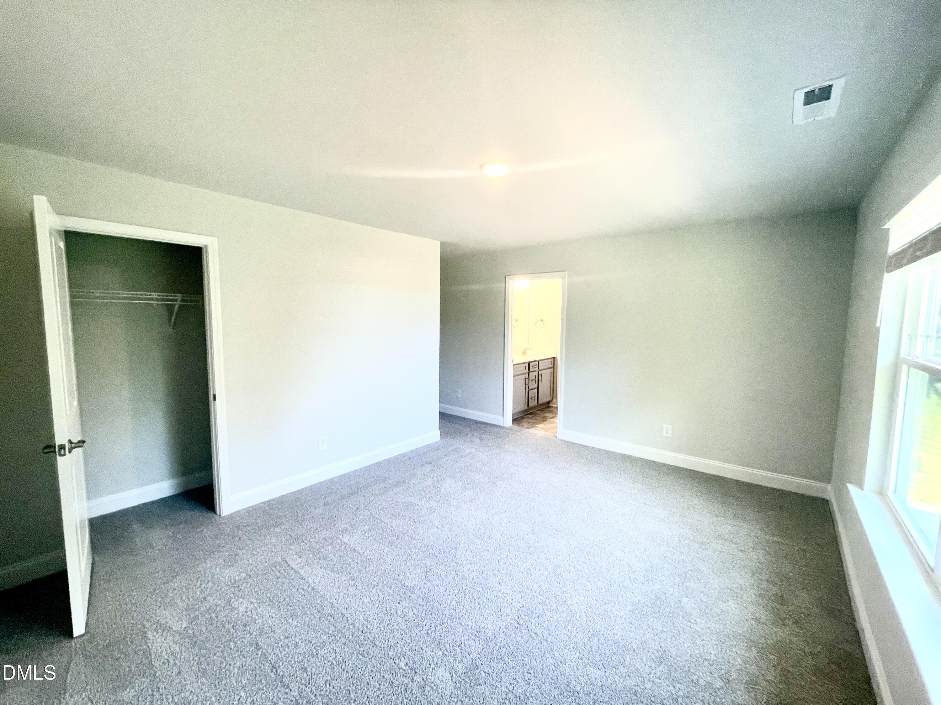 39 Deep Blue Trail Middlesex, NC 27557 - Photo 29 of 37 an empty room with a natural light