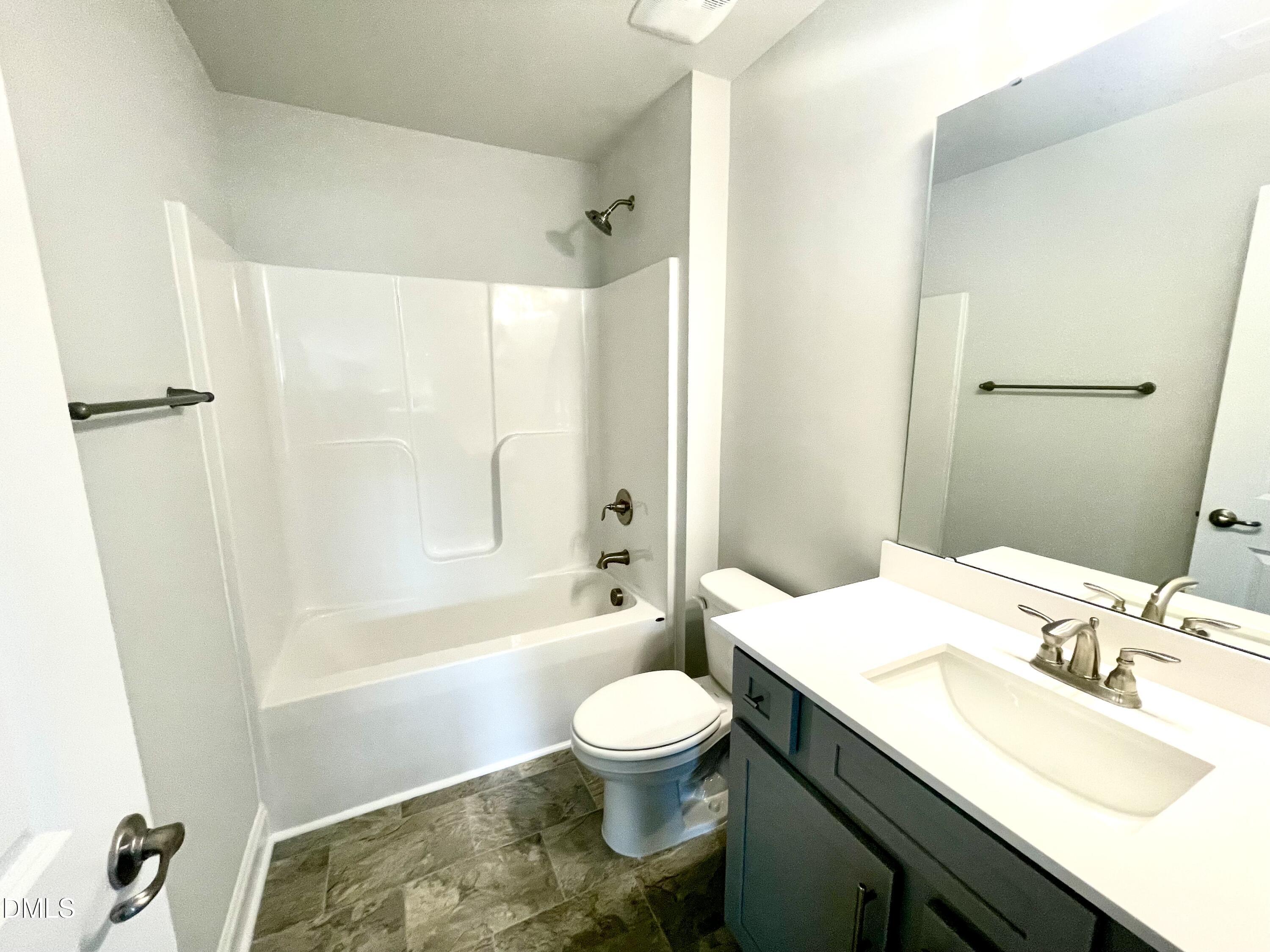39 Deep Blue Trail Middlesex, NC 27557 - Photo 32 of 37 a bathroom with a sink toilet tub and shower