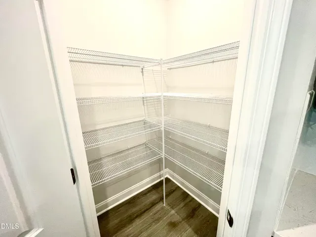 a bathroom with a toilet and a mirror