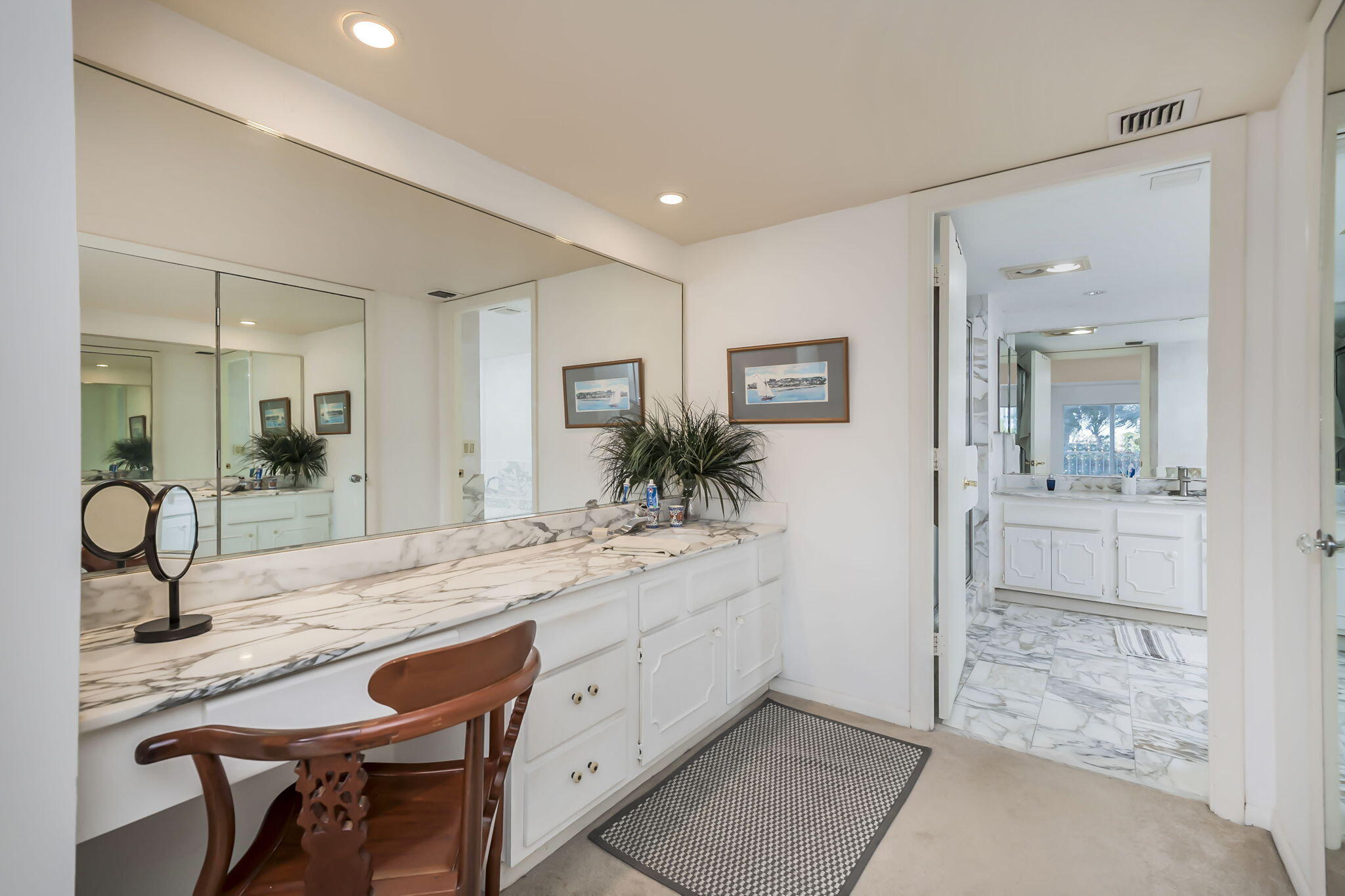 4301 North Ocean Boulevard, Unit A206 Boca Raton, FL 33431 - Photo 17 of 37 a spacious bathroom with a granite countertop sink a mirror and shower