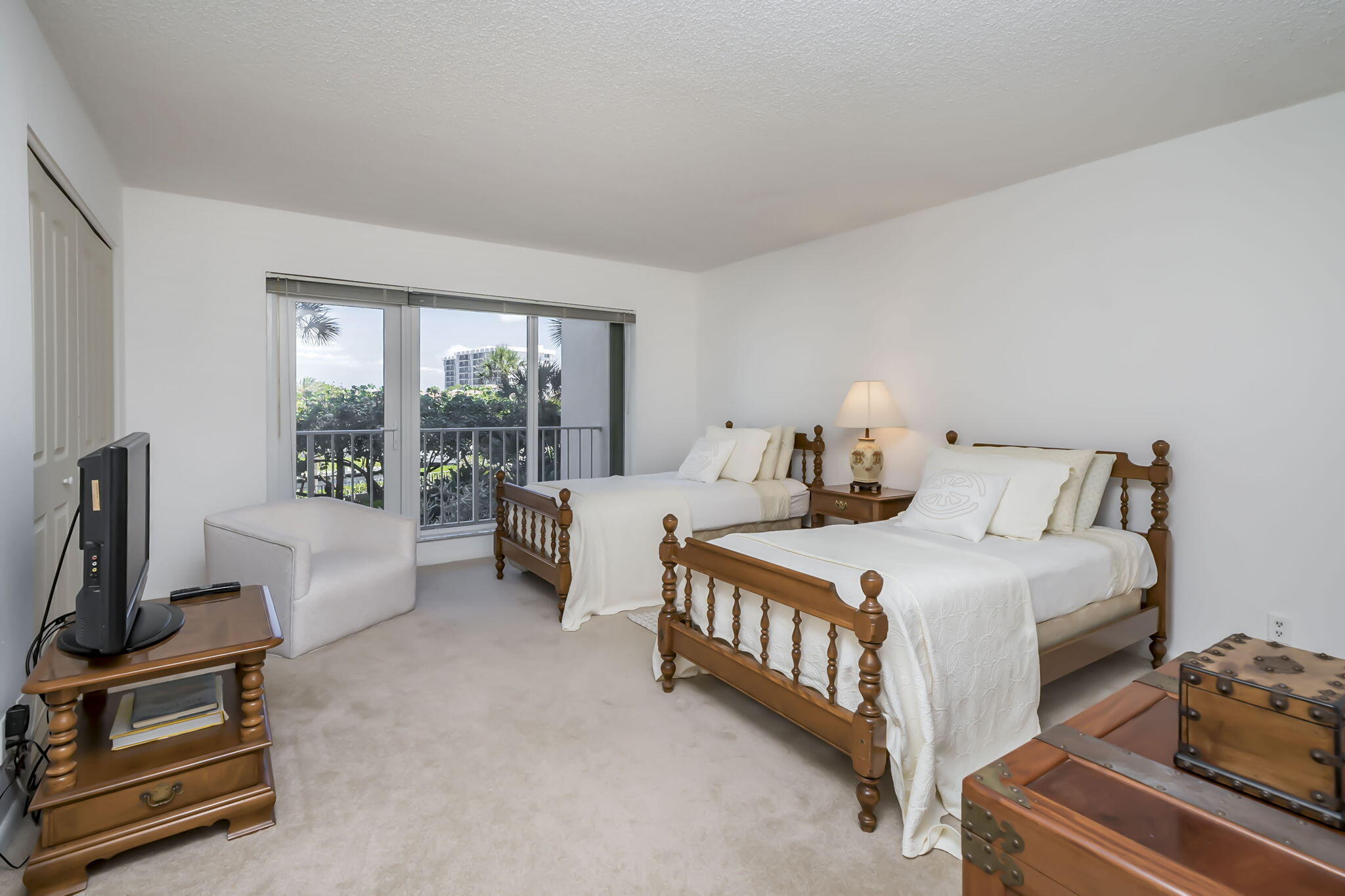 4301 North Ocean Boulevard, Unit A206 Boca Raton, FL 33431 - Photo 23 of 37 a bedroom with a bed and a couch
