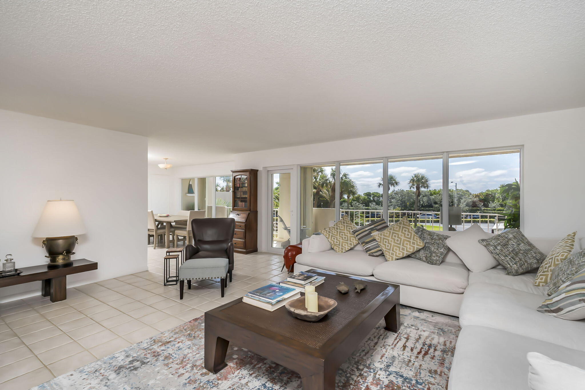 4301 North Ocean Boulevard, Unit A206 Boca Raton, FL 33431 - Photo 3 of 37 a living room with furniture and a large window
