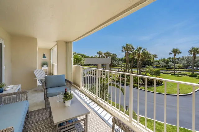a view of a balcony with chairs