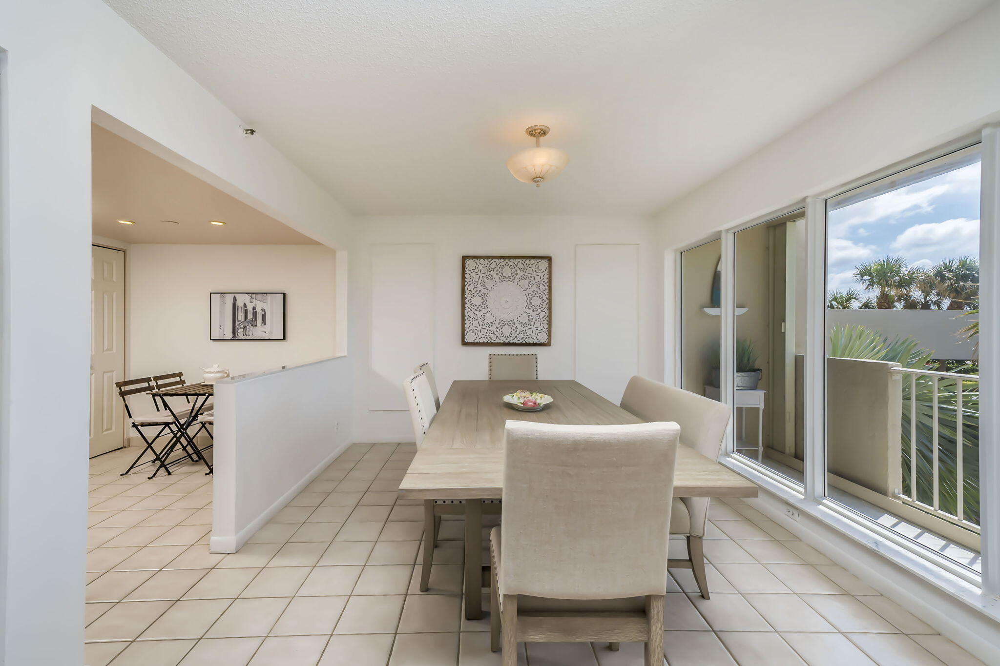 4301 North Ocean Boulevard, Unit A206 Boca Raton, FL 33431 - Photo 5 of 37 a dining room with furniture and window