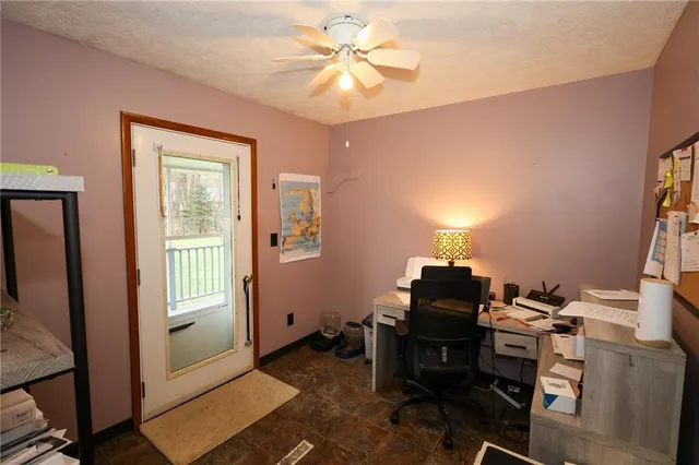 a workspace with furniture and window