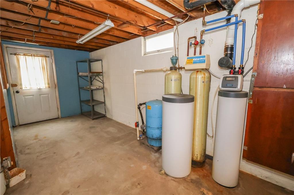 470 North Liberty Road Grove City, PA 16127 - Photo 30 of 34 a view of a storage & utility room with water heater and racks