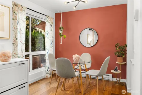 a dining room with furniture and window