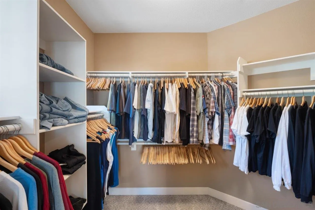 2319 Ranchview Place Escondido, CA 92027 - Photo 26 of 47 a view of walk in closet with clothes and shoes