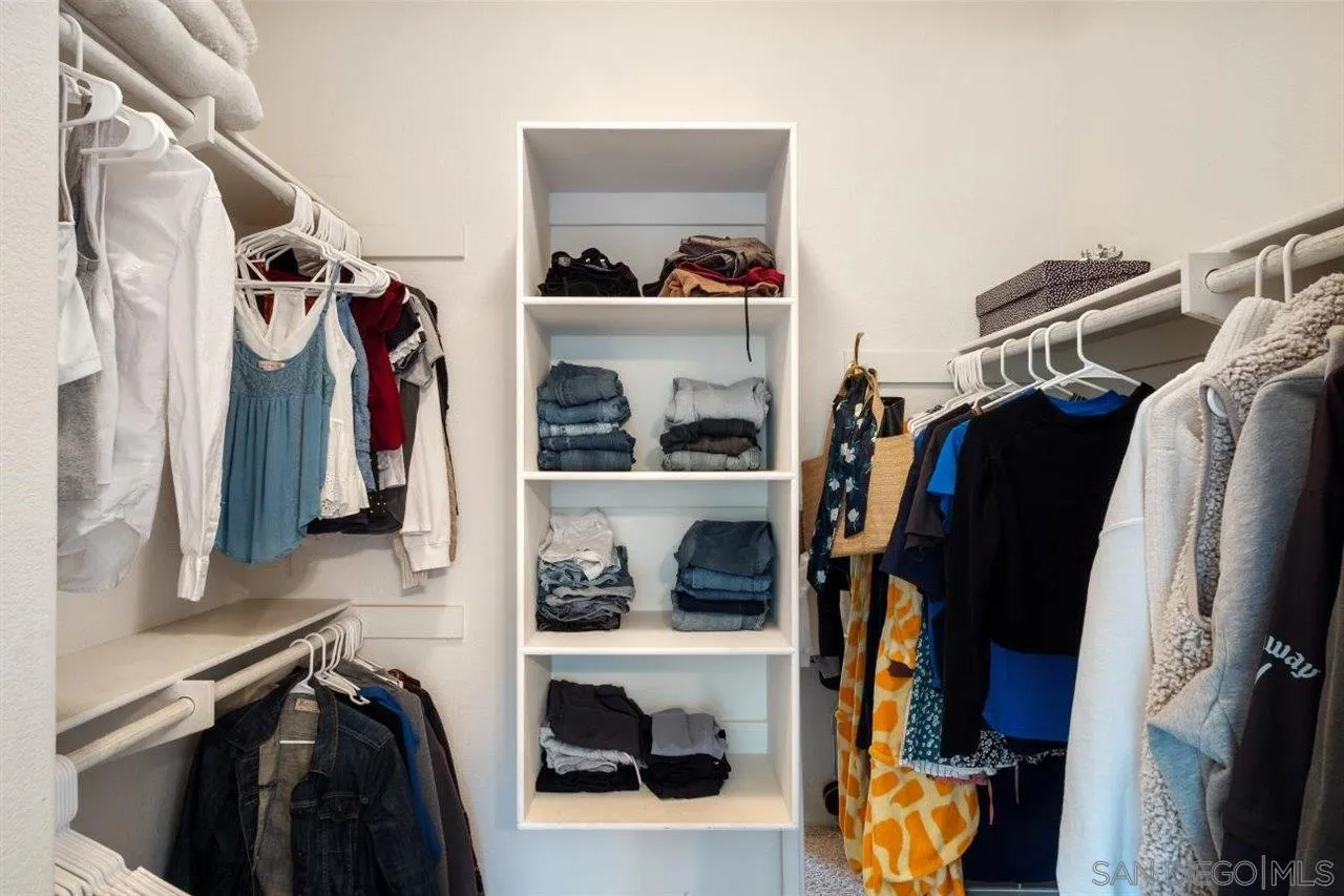 2319 Ranchview Place Escondido, CA 92027 - Photo 33 of 47 a view of walk in closet with clothes and shoes