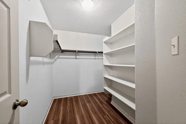 a view of an empty walk in closet
