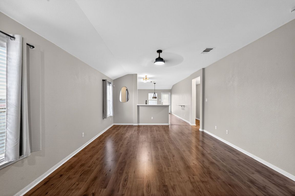 13237 Pine Needle Street Manor, TX 78653 - Photo 4 of 16 living room featuring dark wood-style floors and ceiling fan