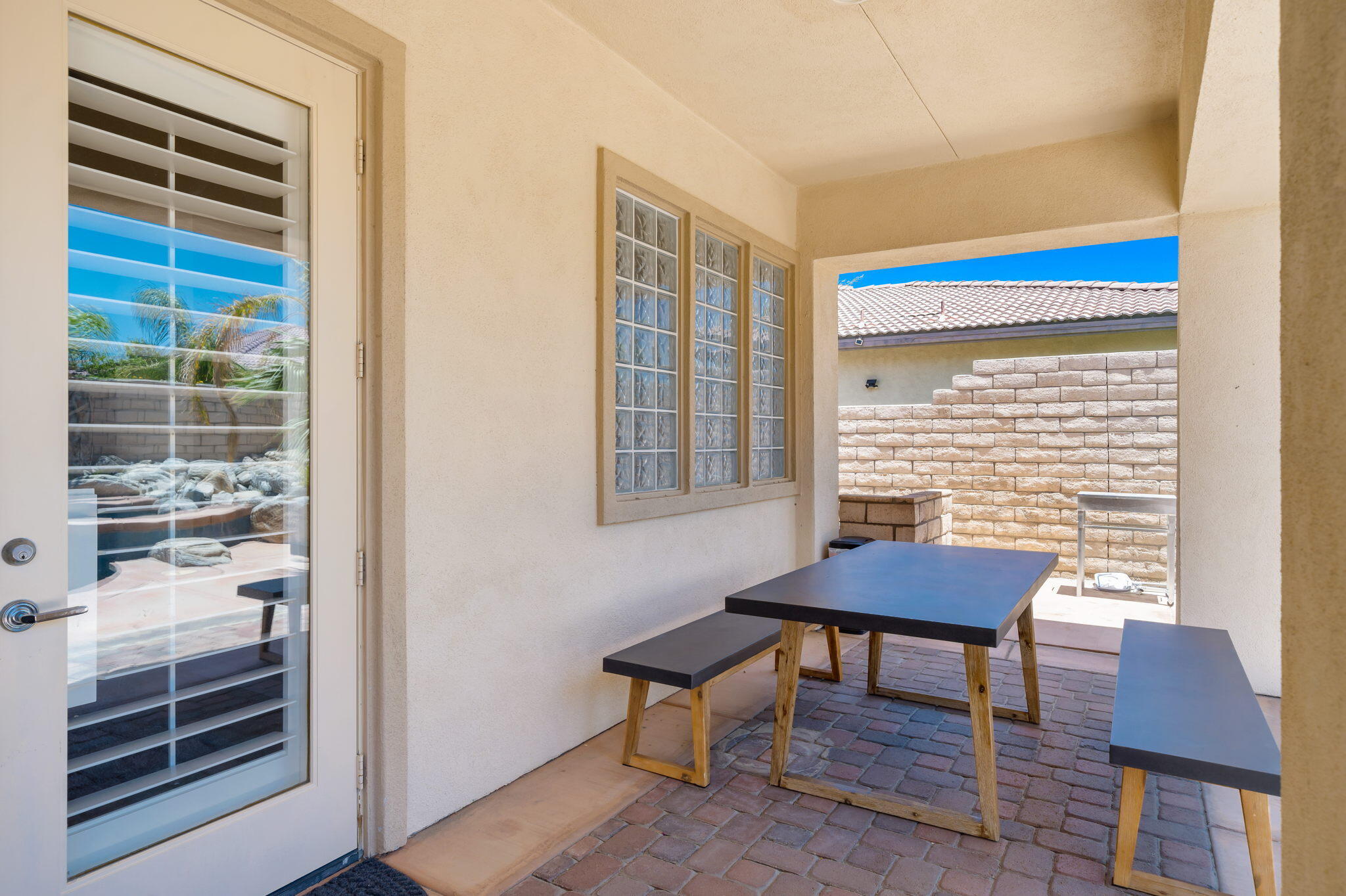 68 Via Del Pienza Rancho Mirage, CA 92270 - Photo 12 of 38 a view of a workspace with furniture and a window