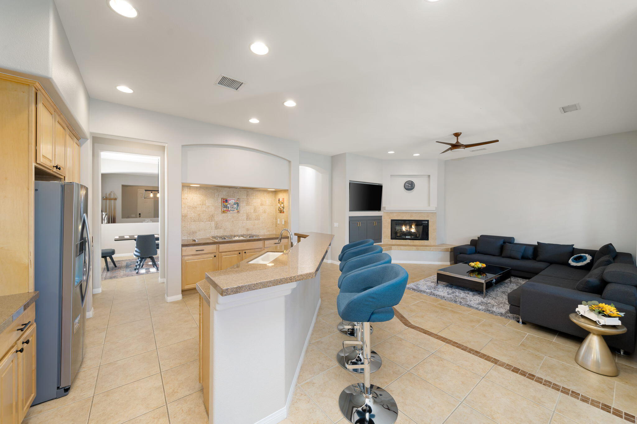 68 Via Del Pienza Rancho Mirage, CA 92270 - Photo 25 of 38 a living room with furniture kitchen view and a wooden floor