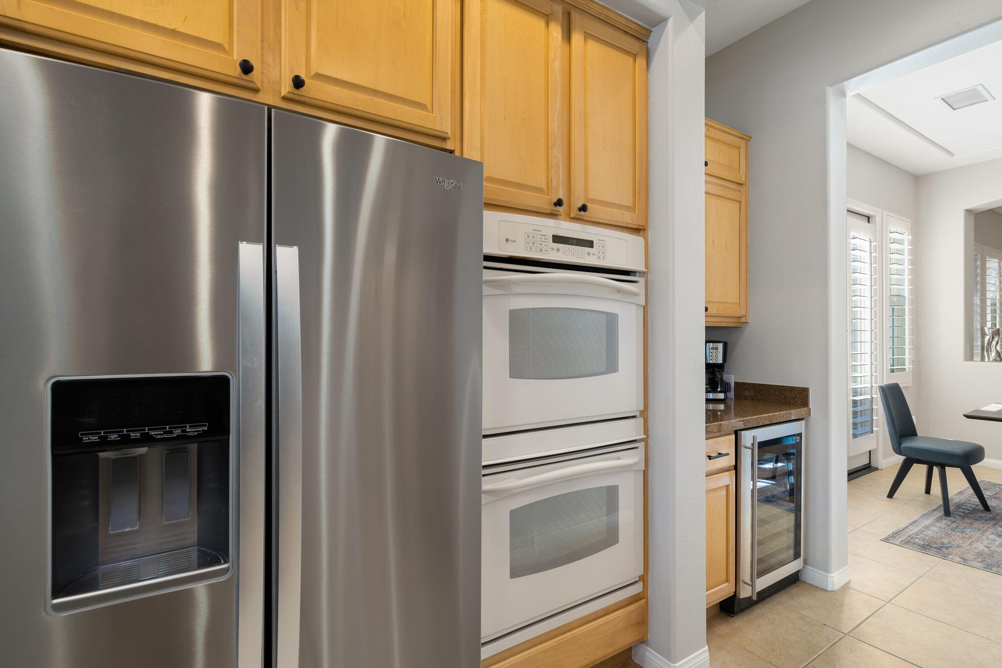 68 Via Del Pienza Rancho Mirage, CA 92270 - Photo 27 of 38 a kitchen with stainless steel appliances a refrigerator stove and cabinets