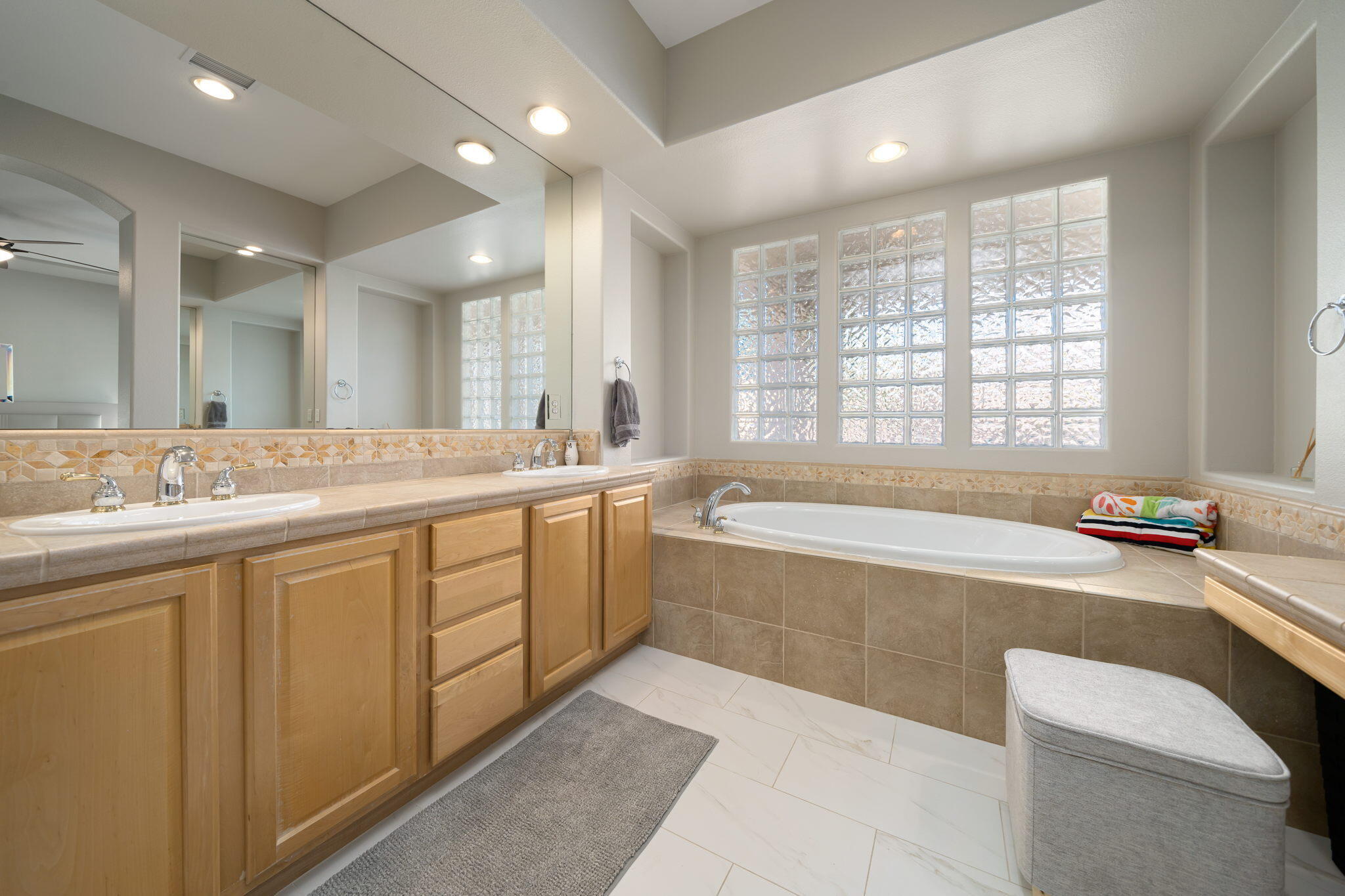 68 Via Del Pienza Rancho Mirage, CA 92270 - Photo 29 of 38 a spacious bathroom with a large tub sink and mirror