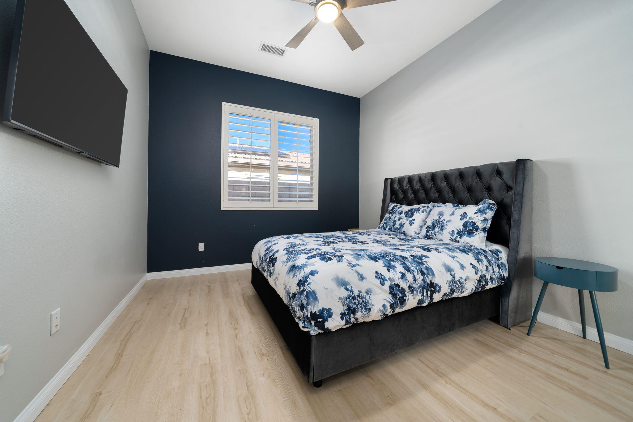 68 Via Del Pienza Rancho Mirage, CA 92270 - Photo 31 of 38 a bedroom with a bed lamp and a large window