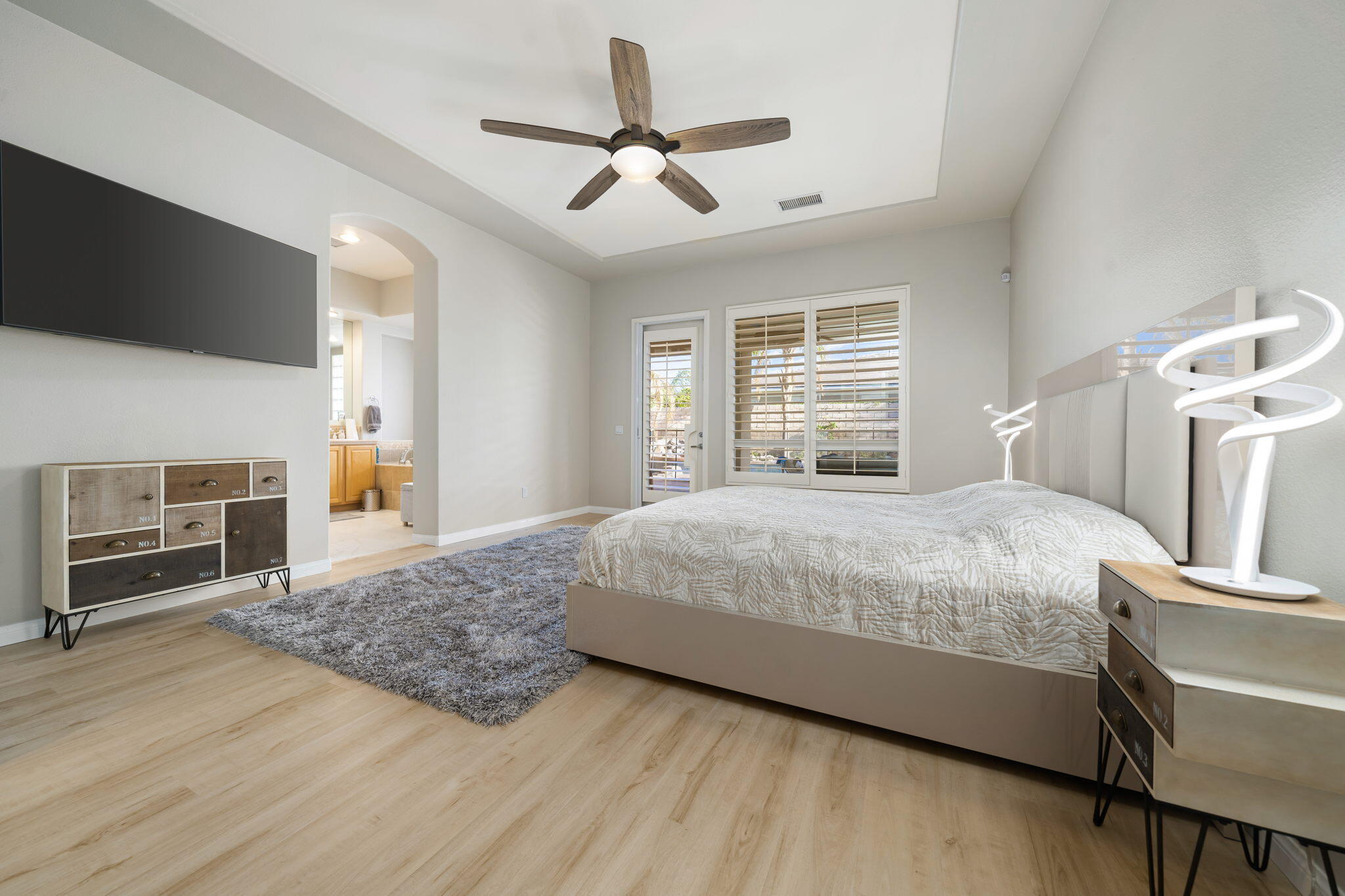 68 Via Del Pienza Rancho Mirage, CA 92270 - Photo 6 of 38 a bedroom with a bed and a television