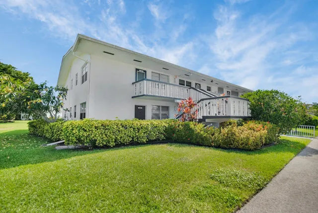 a aerial view of a house with a garden and yard