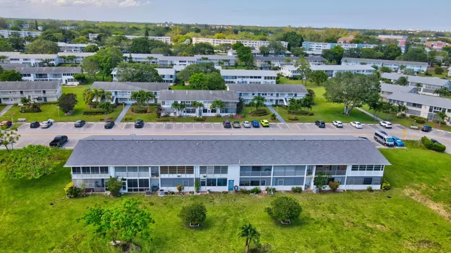 a view of a swimming pool with a yard