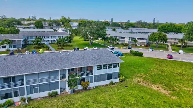 a view of a shop with tables and chairs
