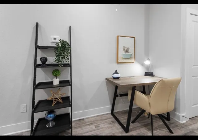 a view of a workspace with furniture