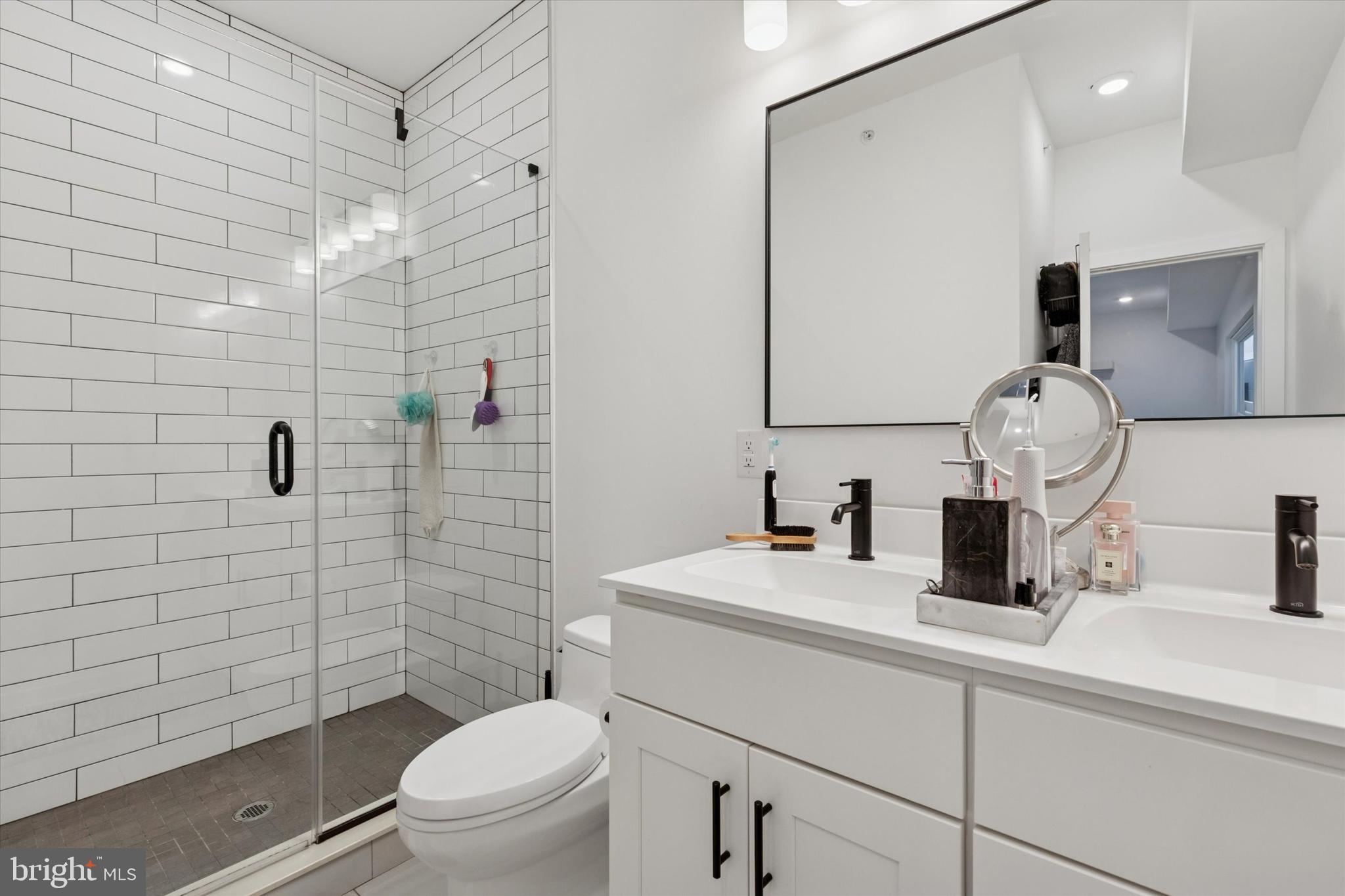22 East Rittenhouse Street Philadelphia, PA 19144 - Photo 13 of 34 a bathroom with a sink a toilet and shower