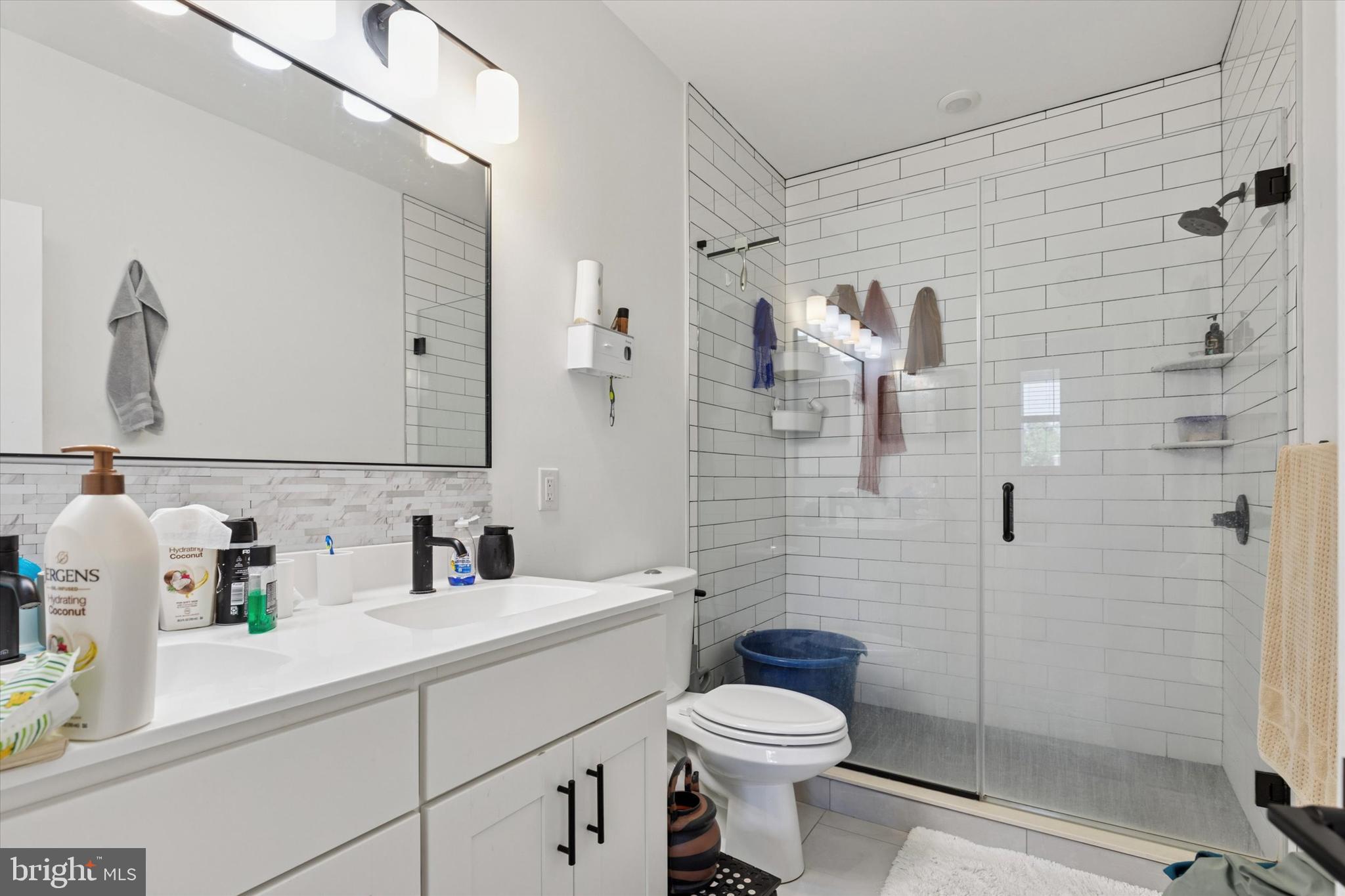 22 East Rittenhouse Street Philadelphia, PA 19144 - Photo 17 of 34 a bathroom with a toilet sink and shower