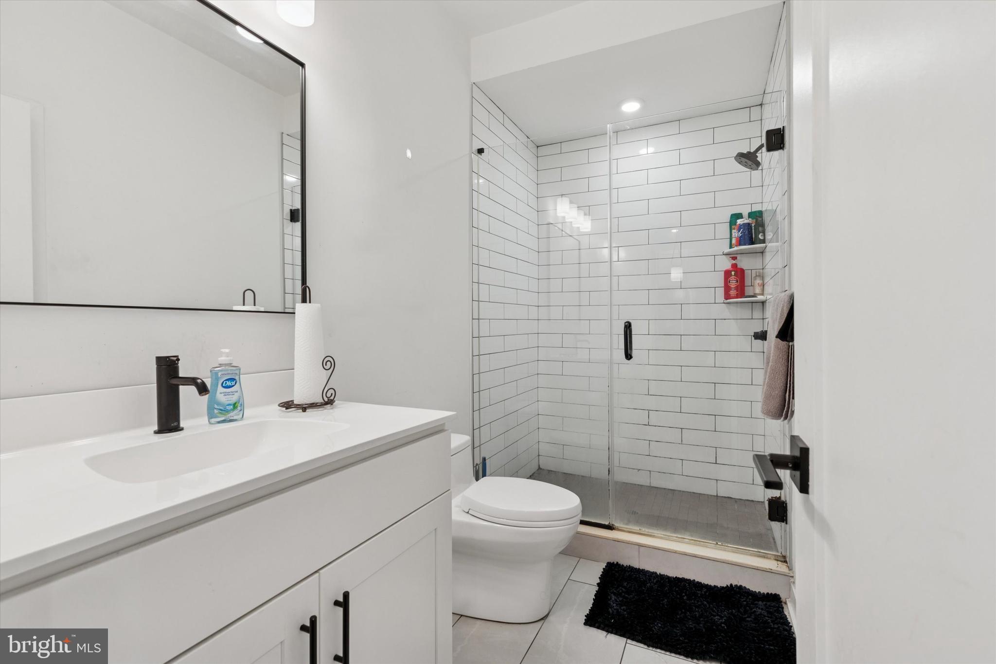 22 East Rittenhouse Street Philadelphia, PA 19144 - Photo 21 of 34 a bathroom with a sink a toilet and shower