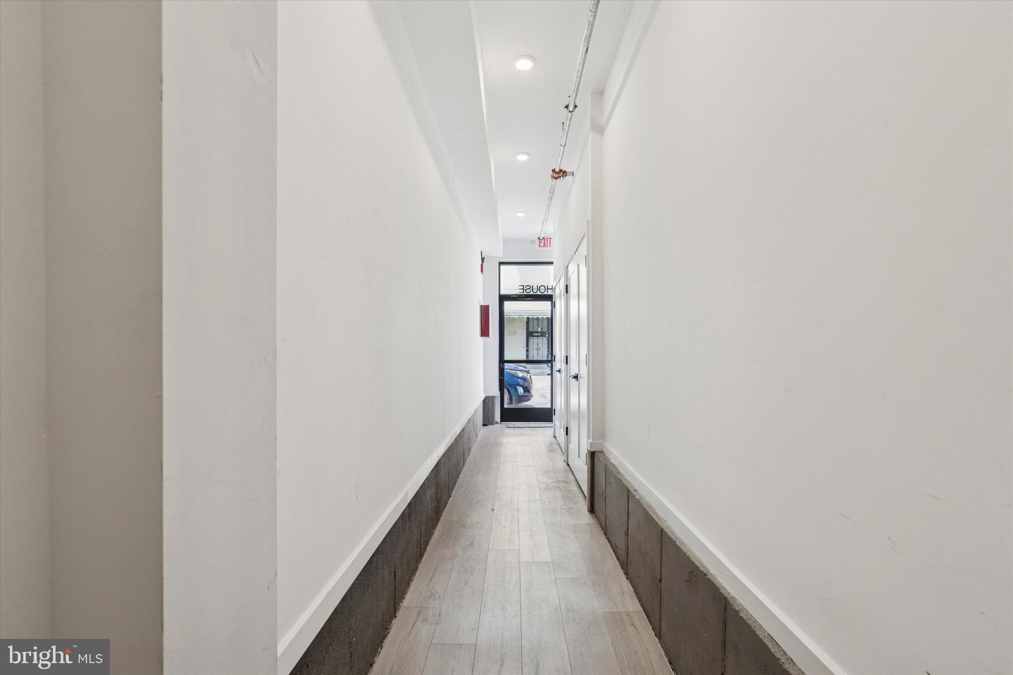 22 East Rittenhouse Street Philadelphia, PA 19144 - Photo 3 of 34 a view of a hallway with wooden floor and staircase