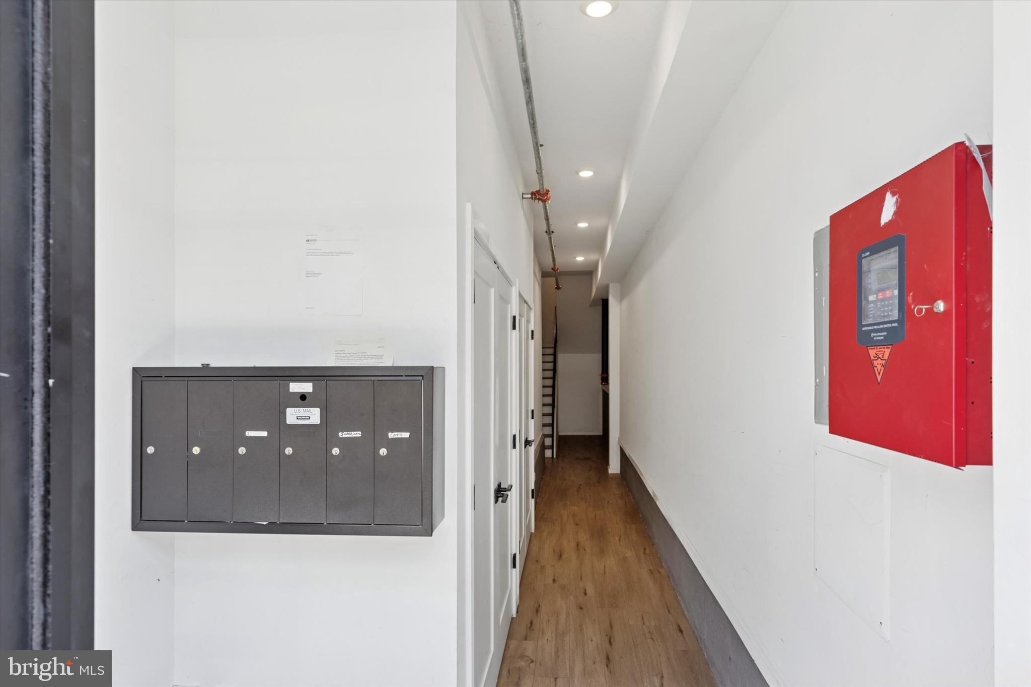 22 East Rittenhouse Street Philadelphia, PA 19144 - Photo 31 of 34 a view of a hallway with wooden floor and staircase