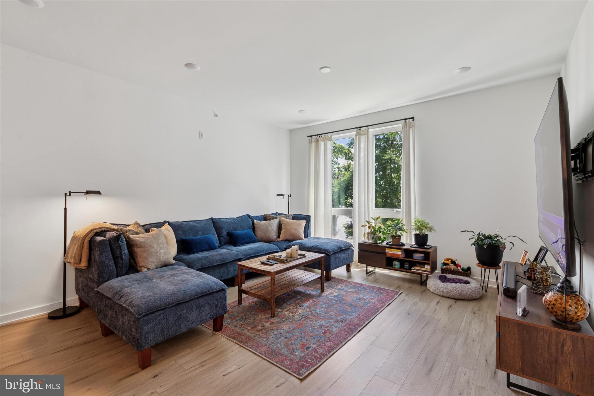 22 East Rittenhouse Street Philadelphia, PA 19144 - Photo 4 of 34 a living room with furniture and a large window