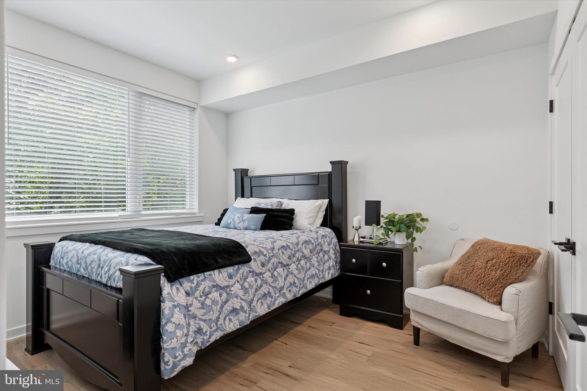 22 East Rittenhouse Street Philadelphia, PA 19144 - Photo 8 of 34 a bedroom with a bed and a couch