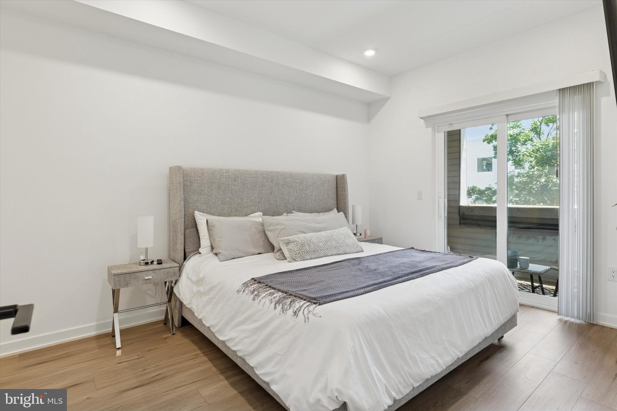 22 East Rittenhouse Street Philadelphia, PA 19144 - Photo 10 of 34 a bedroom with a bed and a large window