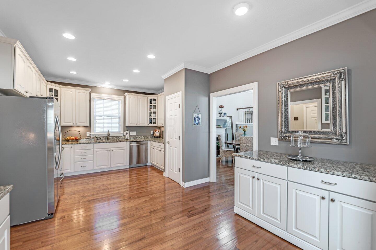 7731 Timber Ridge Drive Powell, OH 43065 - Photo 24 of 42 Island Cabinetry can slide to wall when more space is desired