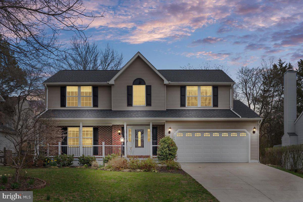 10415 Labrador Loop Manassas, VA 20112 - Photo 1 of 66 a front view of a house with a yard and garage