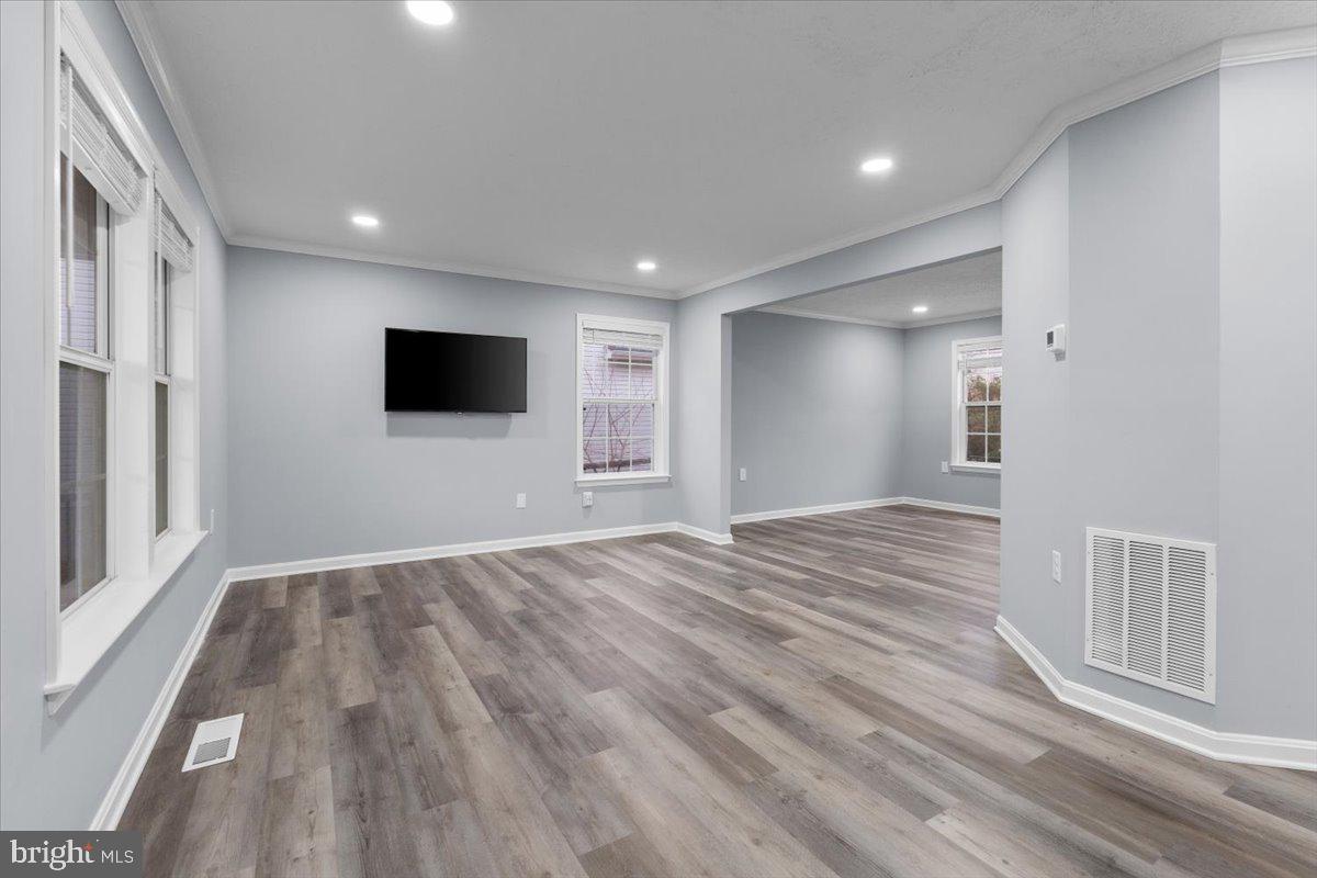 10415 Labrador Loop Manassas, VA 20112 - Photo 27 of 66 a view of empty room with wooden floor and fan
