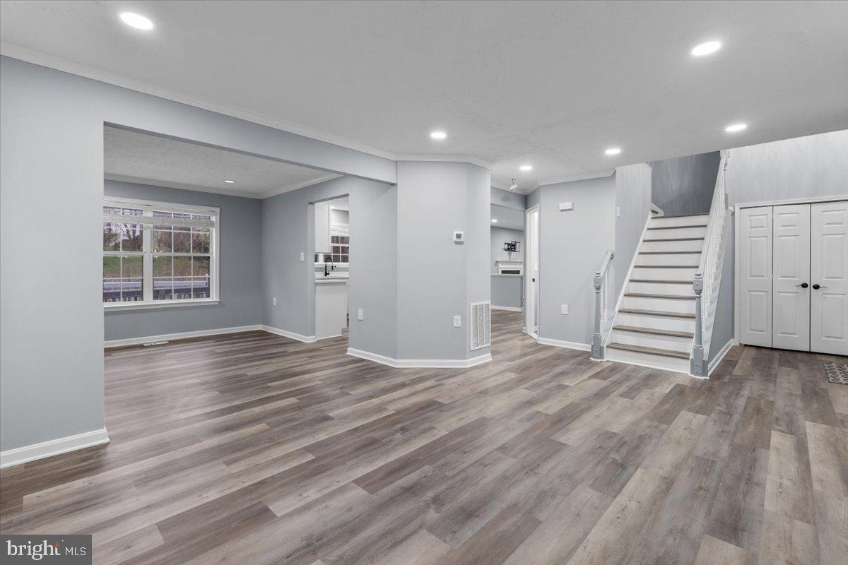 10415 Labrador Loop Manassas, VA 20112 - Photo 29 of 66 an empty room with wooden floor and windows