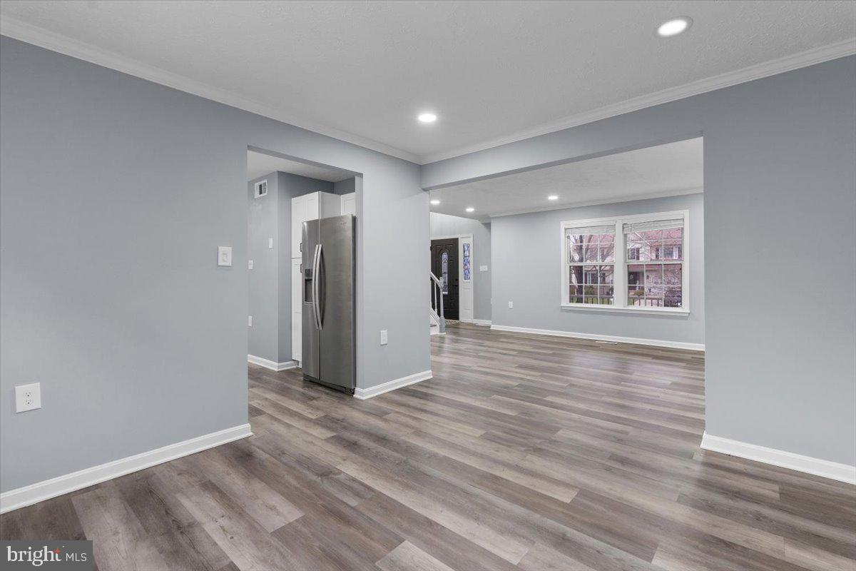 10415 Labrador Loop Manassas, VA 20112 - Photo 31 of 66 a view of an empty room with window and wooden floor