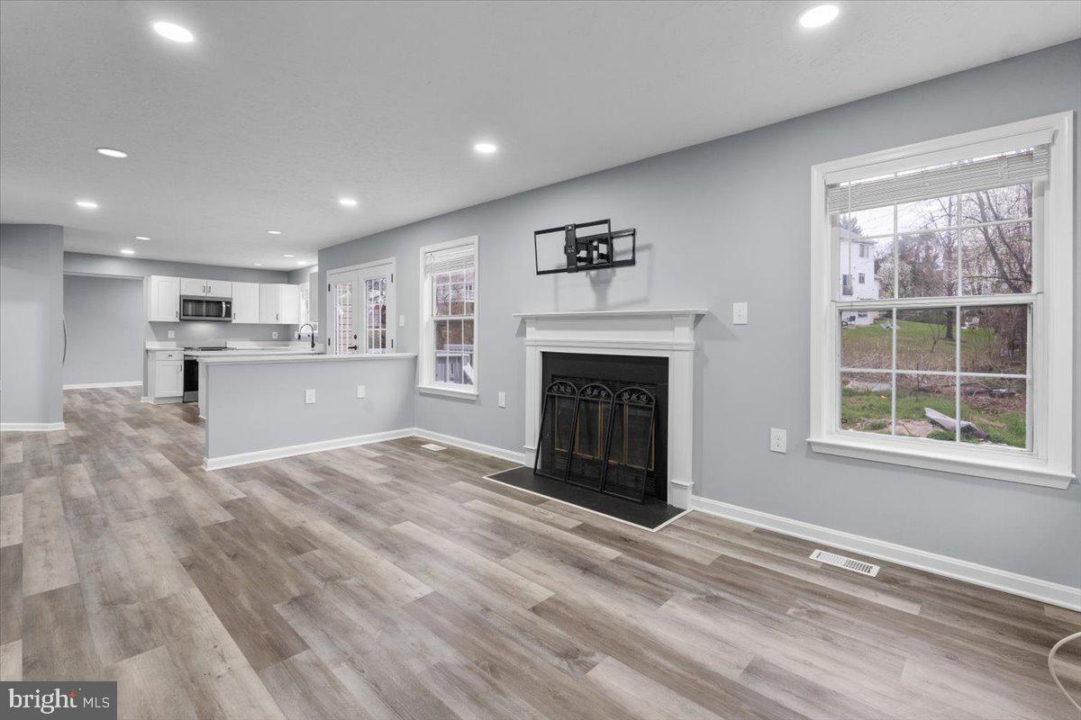 10415 Labrador Loop Manassas, VA 20112 - Photo 38 of 66 a view of an empty room with a window and fireplace