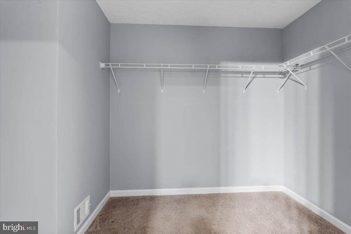 10415 Labrador Loop Manassas, VA 20112 - Photo 43 of 66 a view of walk in closet with empty racks