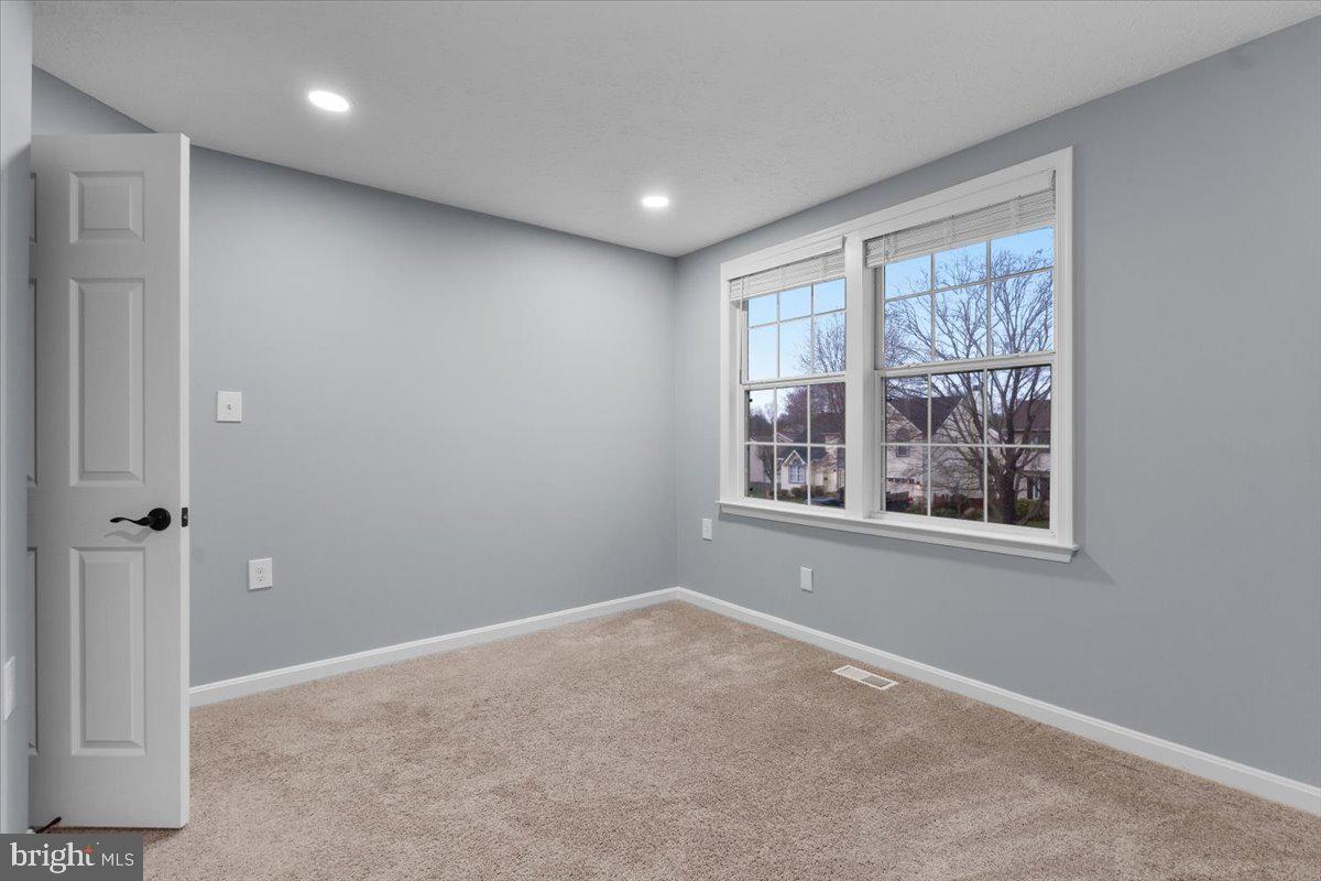 10415 Labrador Loop Manassas, VA 20112 - Photo 49 of 66 a view of an empty room with a window