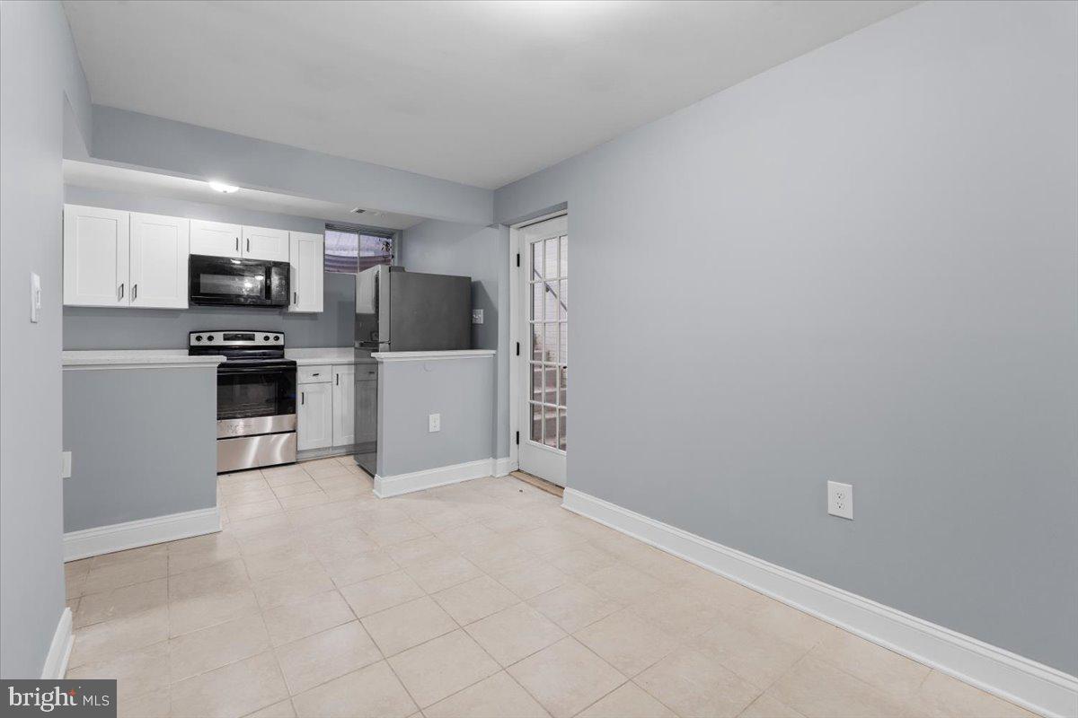 10415 Labrador Loop Manassas, VA 20112 - Photo 53 of 66 a view of kitchen with refrigerator stove microwave and cabinets