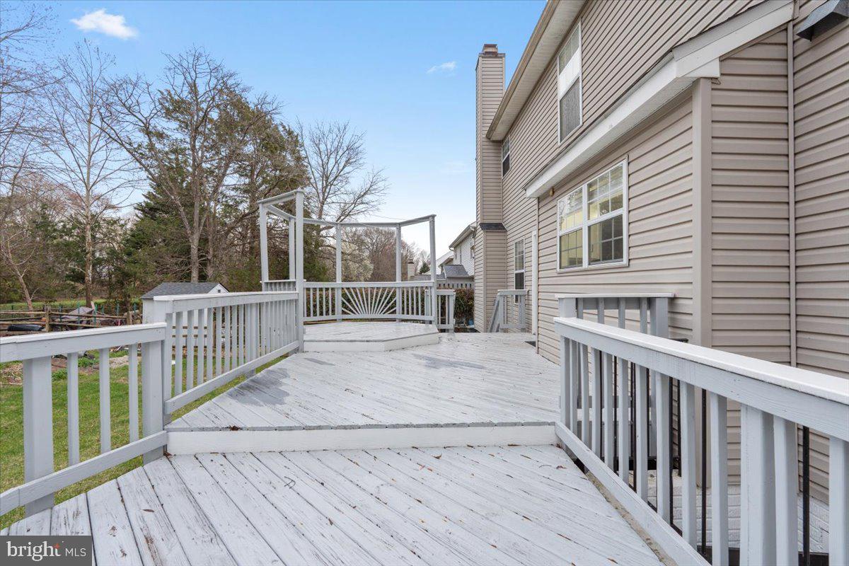 10415 Labrador Loop Manassas, VA 20112 - Photo 63 of 66 a view of a house with backyard and deck
