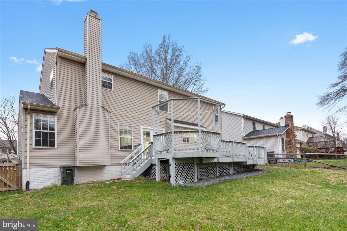 10415 Labrador Loop Manassas, VA 20112 - Photo 65 of 66 a view of a house with a yard and sitting area
