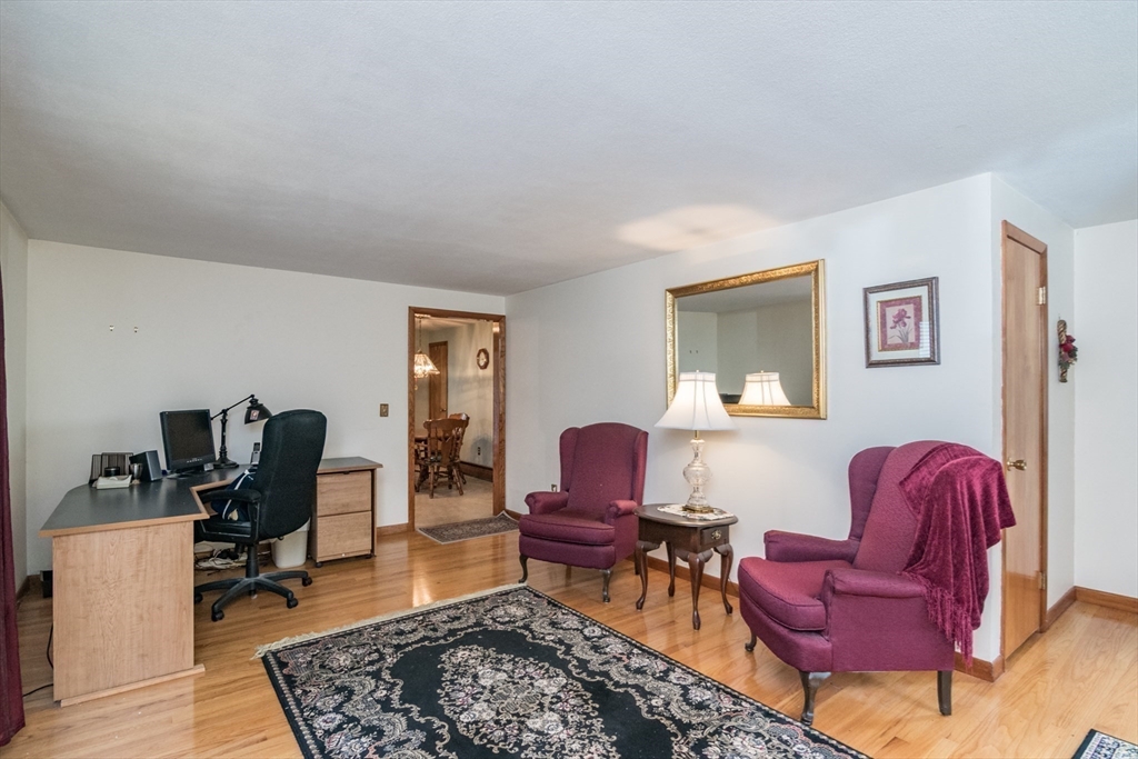 195 Mildred Avenue Springfield, MA 01104 - Photo 11 of 32 a living room with furniture and a rug