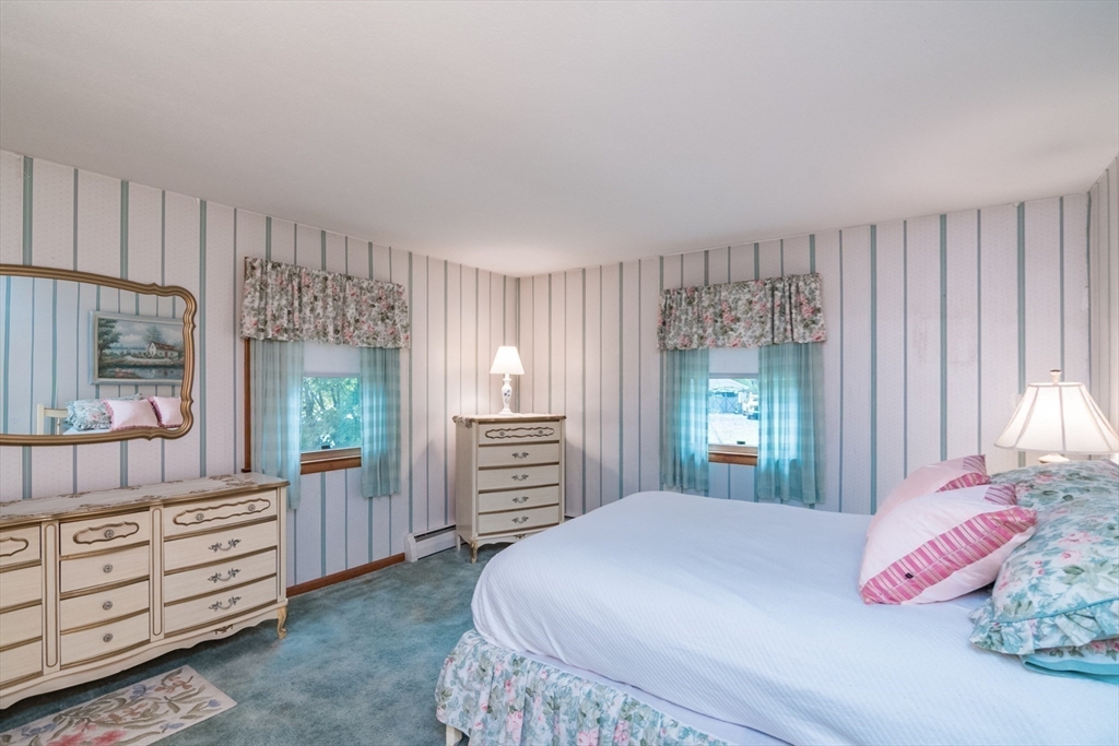 195 Mildred Avenue Springfield, MA 01104 - Photo 20 of 32 a bedroom with a large bed and large windows